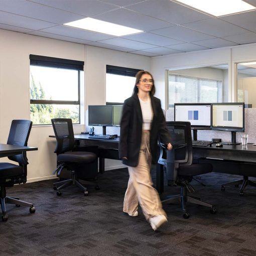 Girl walking in front of Buro Metro II 24/7 Chair