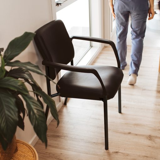 Buro Lindis 4 Leg | Black Frame, Black fabric, With Arms | Angled To Side From Above In-Situ