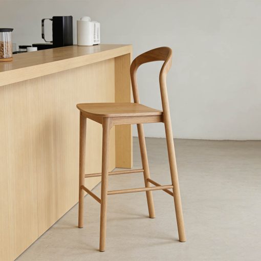 Nodo timber chair angled to angled to side in situ at kitchen bar