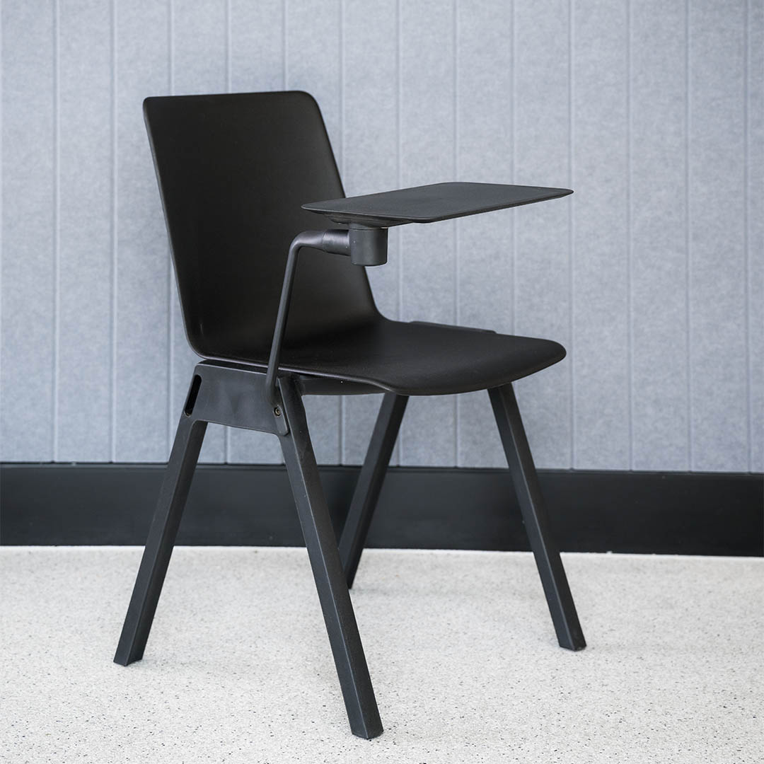 Academy stacking chair black with tablet arm attached in-situ